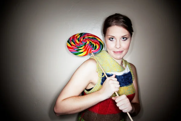 Cute Girl in Spotlight with Lollipop — Stock Photo, Image