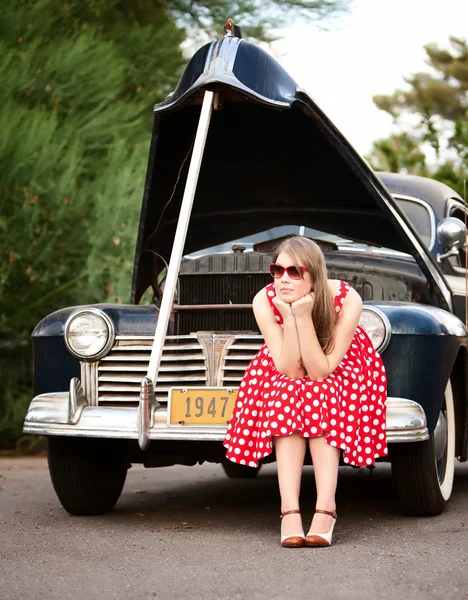 Girl in red with vintage car — Stock Photo, Image