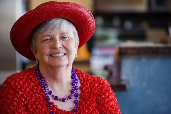 Senior Woman Wearing Red Hat — Stock Photo, Image