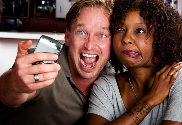 Mixed race couple in coffee house with taking picture cell phone — Φωτογραφία Αρχείου