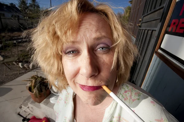 Smoking woman on her porch — Stock Photo, Image