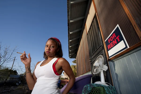 African-American woman in front of house — Stock Photo, Image