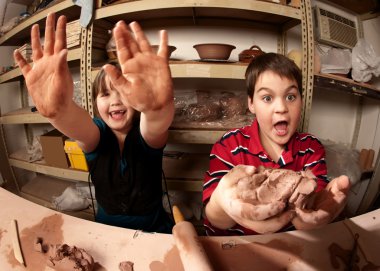Children in a clay studio clipart