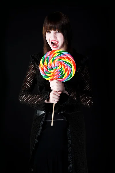 Vampire girl with lollipop — Stock Photo, Image