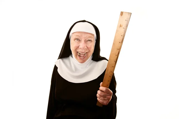 Laughing nun brandishing a ruler — Stock Photo, Image