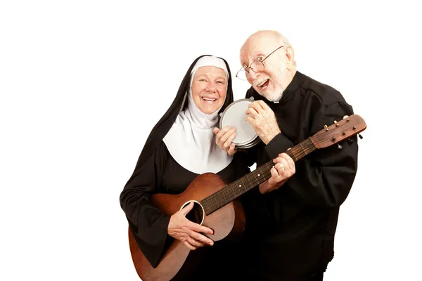 Muzikale priester en non — Stockfoto