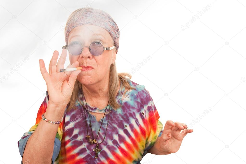 Senior hippie lady smoking