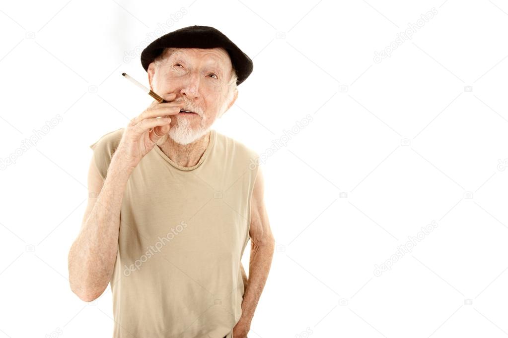 Senior man in beret with cigarette