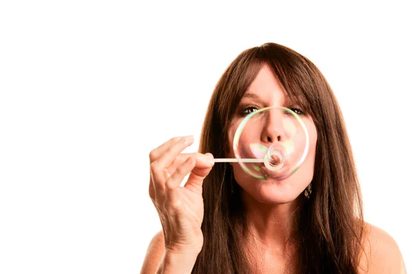 Pretty woman with long hair blowing bubble — Stock Photo, Image