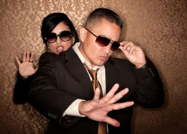 Hispanic couple caught in photographer flash clipart
