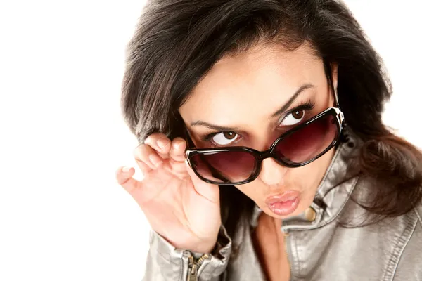 Pretty Hispanic woman looking over her glasses — Stock Photo, Image