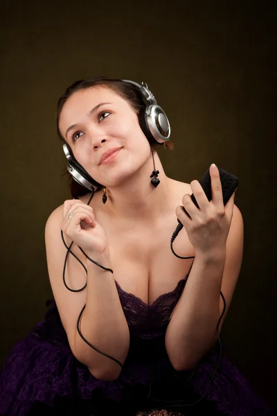 Girl with audio device — Stock Photo, Image