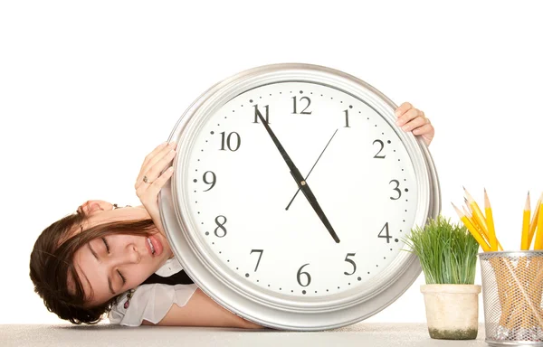 Woman at work holding large clock — Stock Photo, Image