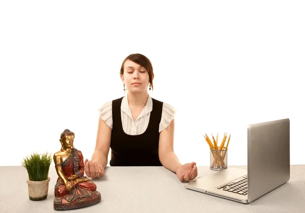 Woman meditating at her desk — Stock Photo, Image