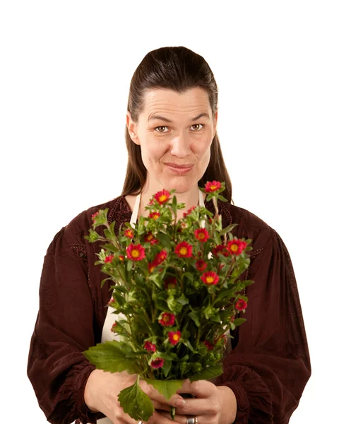 Całkiem dorosła kobieta z kwiatami — Zdjęcie stockowe