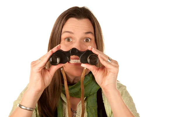 Woman using binoculars — Stock Photo, Image