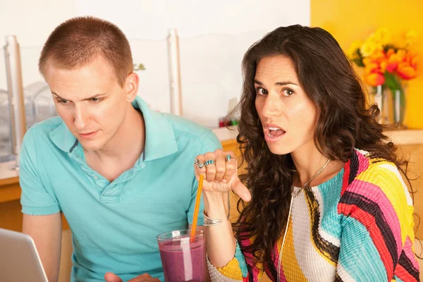 A woman sitting with her boyfriend is giving — Stock Photo, Image