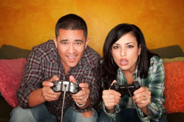 Hispanic Couple Playing Video game clipart