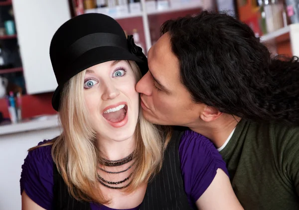 Interracial kiss alone at a cafe — Stock Photo, Image