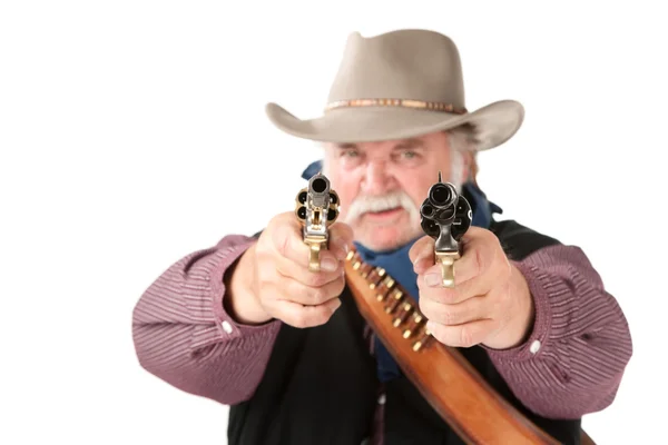 Big cowboy pointing pistols — Stock Photo, Image