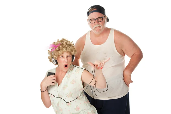 Hillbilly wife dancing with annoyed husband — Stock Photo, Image