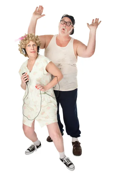 Funny Housewife Dancing in Front of Husband — Stock Photo, Image