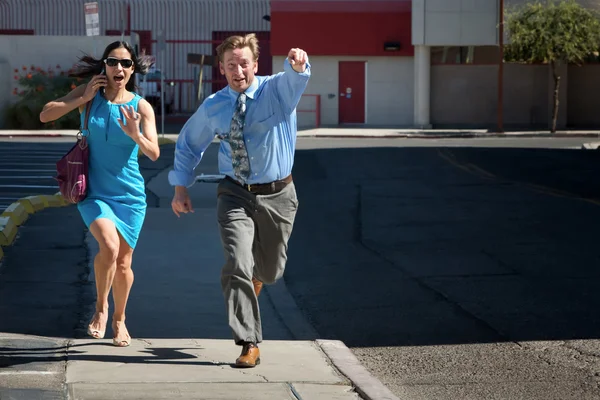 Handsome man and pretty woman are late. — Stock Photo, Image