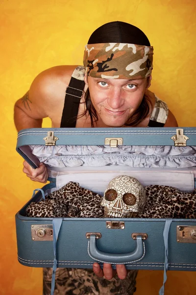 Man with skull in suitcase — Stock Photo, Image