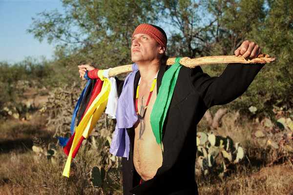 Native American man with colorful flags