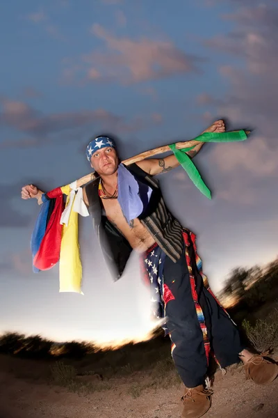 Indigenous man with ceremonial pole — Stock Photo, Image