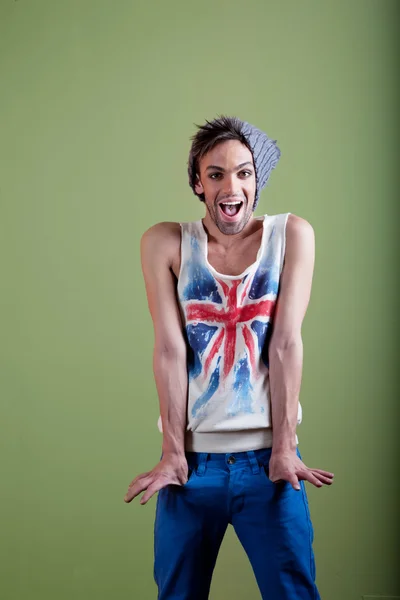 Cute boy in hat tank top and jeans — Stock Photo, Image