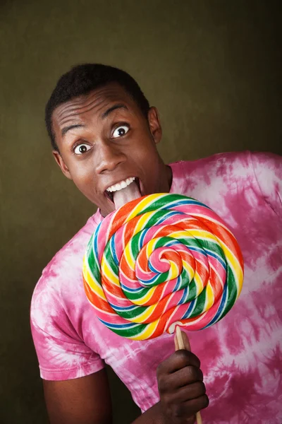 Young man with lollipop — Stock Photo, Image