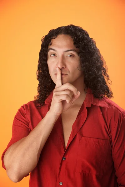 Man with finger to his lips — Stock Photo, Image