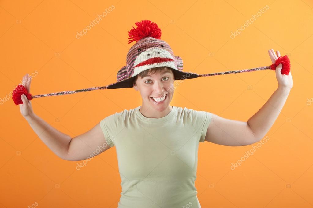 Woman Pulling Her Hat — Stock Photo © creatista 40384583