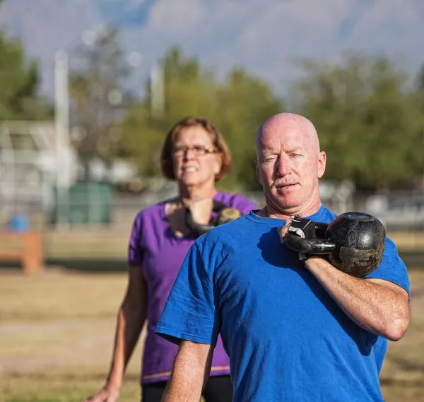 Athletic Mature Man Lifting Weights — Stock Photo, Image