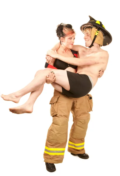 セクシーな消防士はハンサムな男を救う — ストック写真