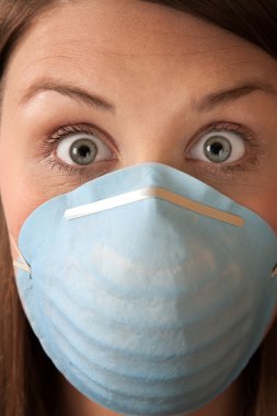 Frightened Woman with Surgical Mask clipart