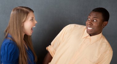 Man Frightened By Angry Woman clipart