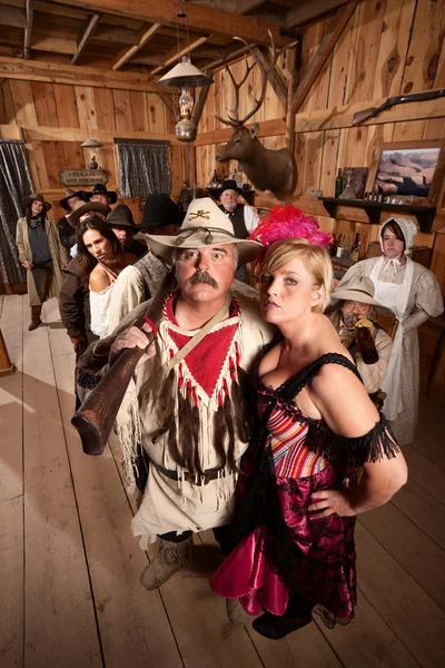 Trapper and Showgirl in Saloon — Stock Photo, Image