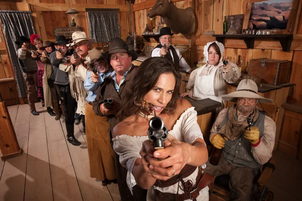 Sexy Woman Points Gun in Saloon — Stock Photo, Image