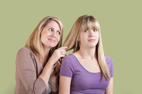 Over Involved Mother with Annoyed Daughter — Stock Photo, Image