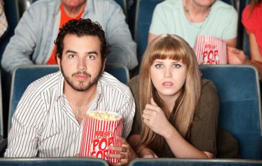 Couple Staring in Theater clipart