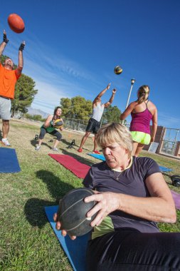 Diverse Group Exercising Outdoors