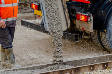Wet ready mix concrete delivered on construction site and discarged of the vagon straight into formwork
