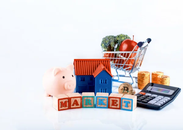Piggy Bank House Calculator Coins Vegetable Cart Inscription Market White — Stock Photo, Image