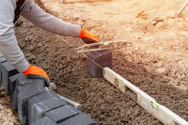 Builder Installing Paving Blocks Road Footpath Construction Semi Dray Concrete — Foto de Stock