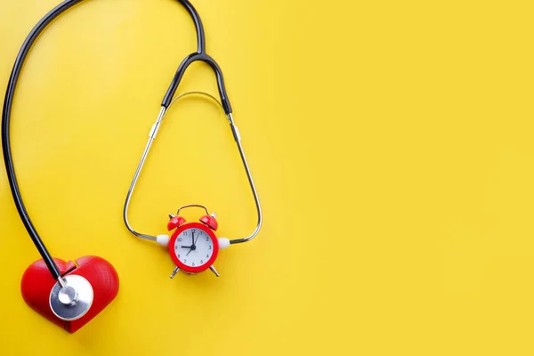 Stethoscope Alarm Clock Yellow Background Time Book Health Check —  Fotos de Stock