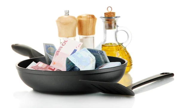 Banknotes in a frying pan with cooking spatula isolated on white — Stock Photo, Image