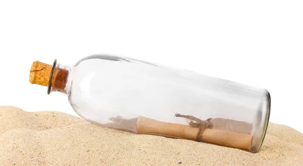 Glass bottle with note inside on sand isolated on white — Stock Photo, Image