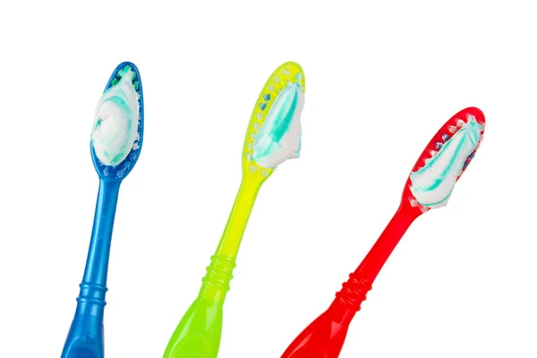 Toothbrushes in glass isolated on white — Stock Photo, Image